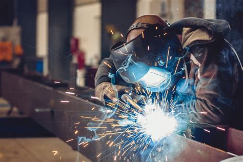 Welder at work in a factory