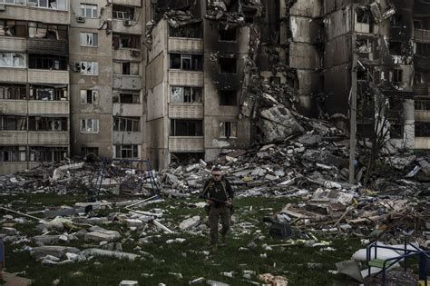 A picture of a person holding a sign that reads 'No to World War 3'