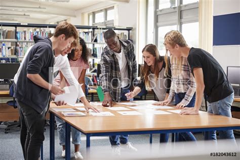 Young Professor Collaborating with Colleagues